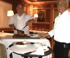chefs carving a roast